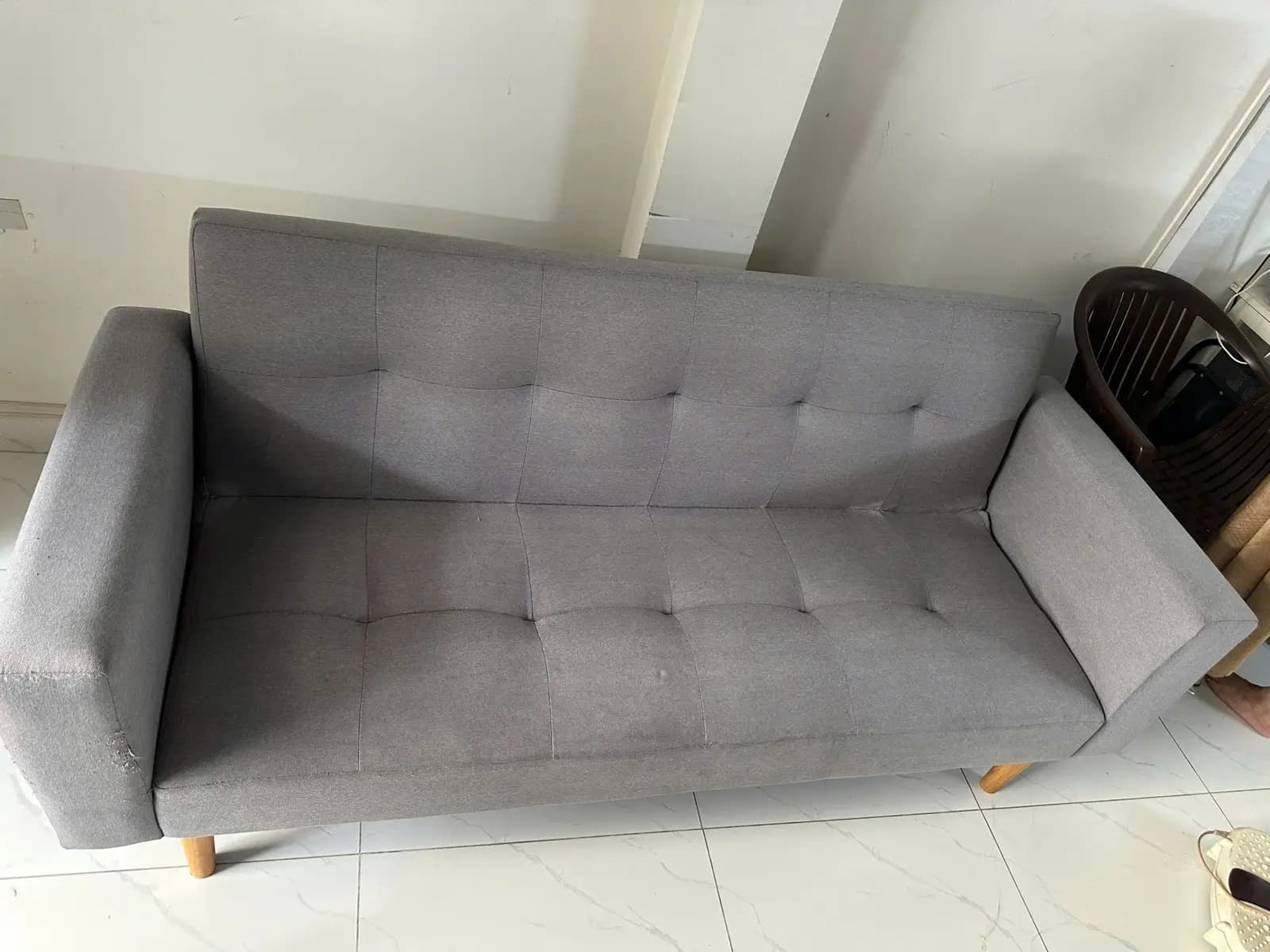 Sofa giường vải xám sau khi vệ sinh bởi S.T Clean